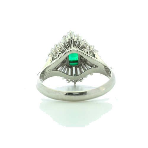 54 - One emerald shaped emerald is surrounded by a marquise shaped cluster of mixed cut diamonds. Ring si... 