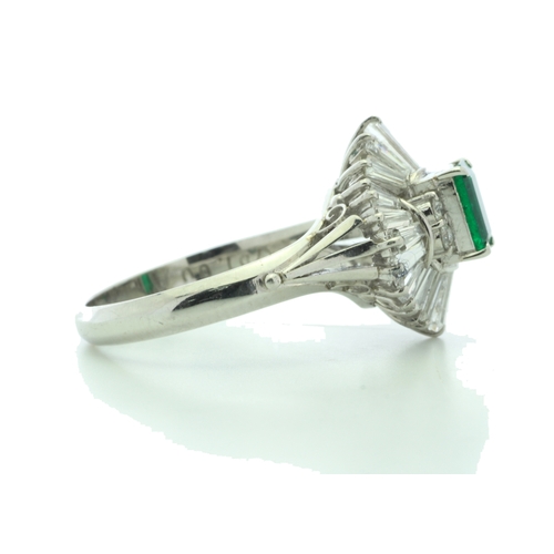 54 - One emerald shaped emerald is surrounded by a marquise shaped cluster of mixed cut diamonds. Ring si... 