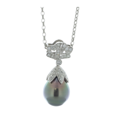 58 - A rare tear-drop shape Tahiti pearl sits beneath a pixie hat style cluster of round brilliant cut di... 