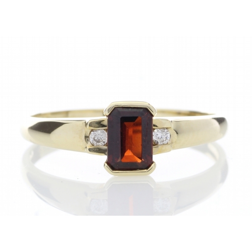 67 - An emerald cut garnet gemstone sits between two round brilliant cut diamonds set into the shoulders ... 