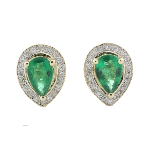 69 - These simple yet classic style stud earrings feature a pear shaped emerald surrounded by a halo of r... 