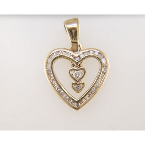 70 - Two natural round brilliant cut diamond is set in the centre of this gorgeous 9ct yellow gold heart ... 