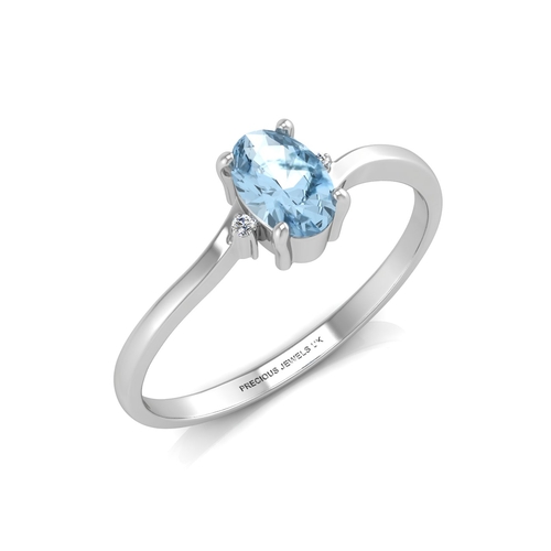 72 - An oval blue topaz is set with one diamond on the shoulder. This 9ct white gold ring is a twist on t... 