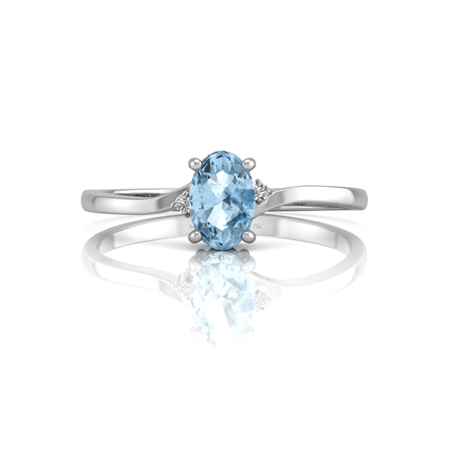 72 - An oval blue topaz is set with one diamond on the shoulder. This 9ct white gold ring is a twist on t... 