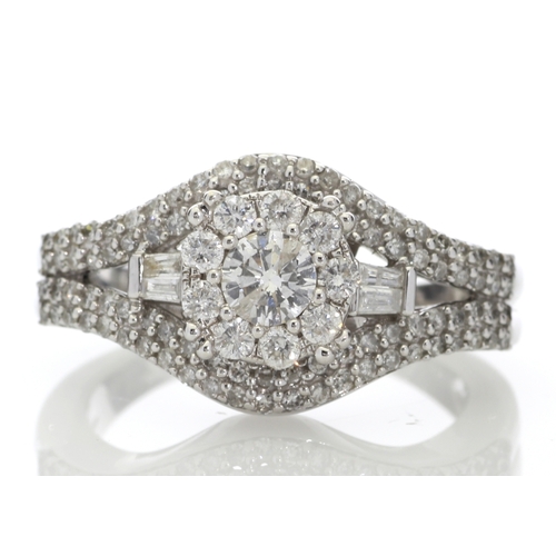 74 - This stunning cluster set 9ct white gold ring is set with a total diamond weight of 1.00 carat. It i... 