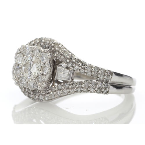 74 - This stunning cluster set 9ct white gold ring is set with a total diamond weight of 1.00 carat. It i... 