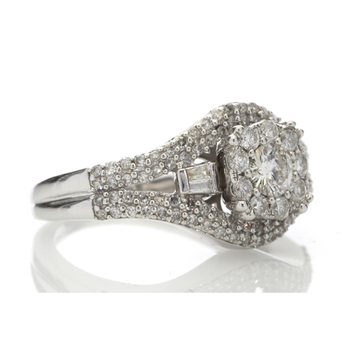 74 - This stunning cluster set 9ct white gold ring is set with a total diamond weight of 1.00 carat. It i... 