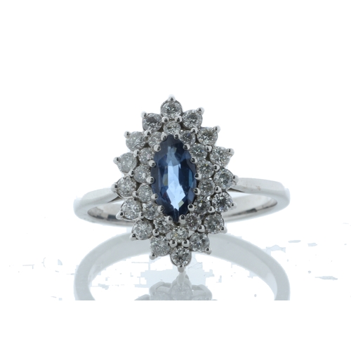 75 - A stunning marquise cut blue topaz gemstone sits surrounded by a double halo set with thirty round b... 