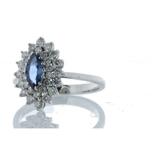 75 - A stunning marquise cut blue topaz gemstone sits surrounded by a double halo set with thirty round b... 