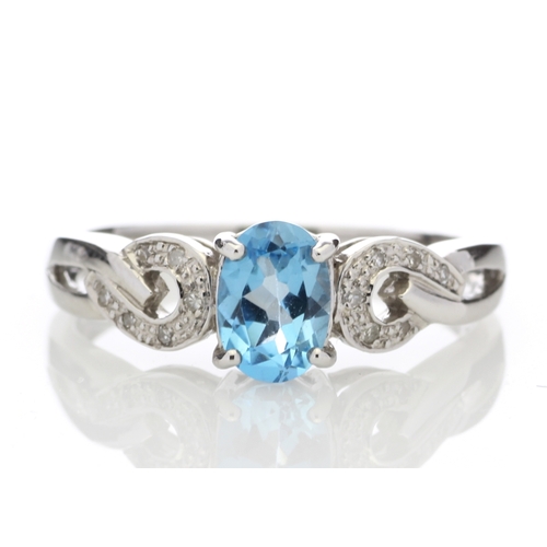 81 - This 0.85 carat oval cut blue topaz sits with six single cut diamonds on the shoulders of this lovel... 