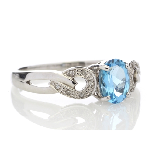 81 - This 0.85 carat oval cut blue topaz sits with six single cut diamonds on the shoulders of this lovel... 