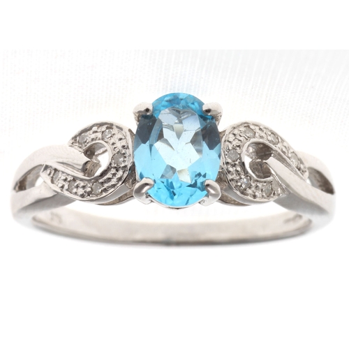 81 - This 0.85 carat oval cut blue topaz sits with six single cut diamonds on the shoulders of this lovel... 