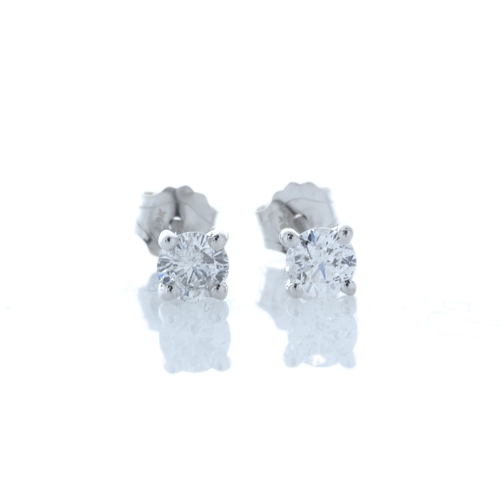 90 - Two round brilliant cut diamonds are set in this classic 18ct white gold stud earrings. Item Specifi... 