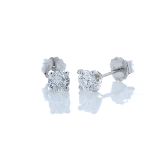 90 - Two round brilliant cut diamonds are set in this classic 18ct white gold stud earrings. Item Specifi... 