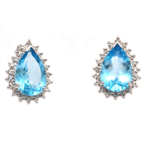 92 - Two pear shaped blue topaz gemstones are surrounded with a halo of diamonds in this stunning stud ea... 