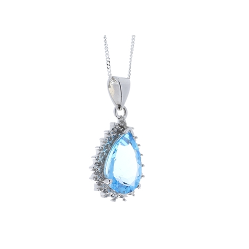 96 - A pear shaped blue topaz gemstone is surrounded by a halo of diamonds. This 9ct white gold pendant i... 