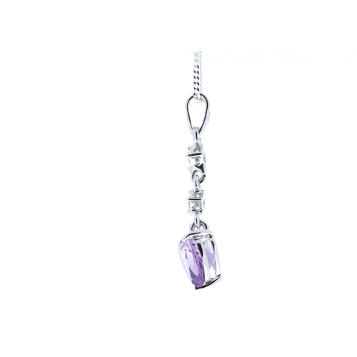 99 - This pendant with two round brilliant diamonds set with a heart shaped amethyst gemstone in 9 carat ... 