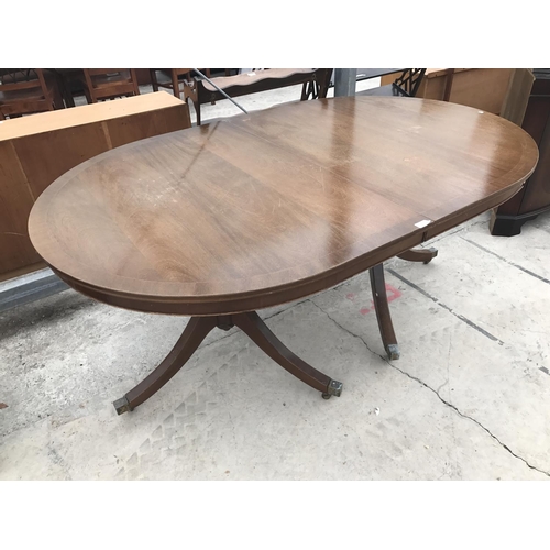 613 - A MAHOGANY DINING TABLE