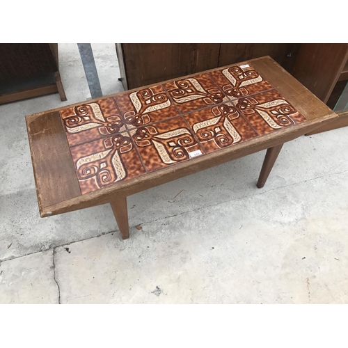 622 - A TEAK TILE TOP COFFEE TABLE