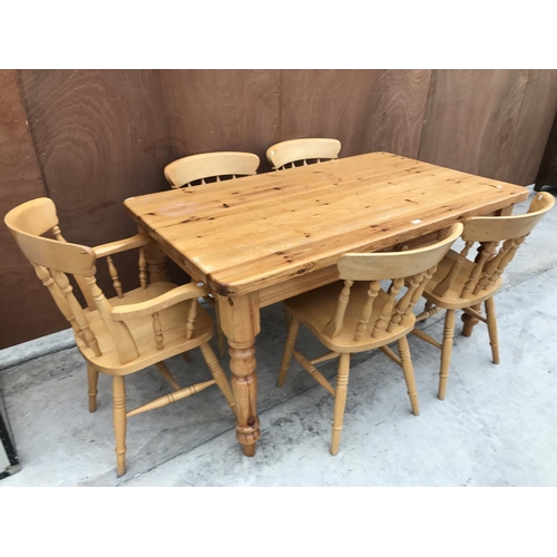 630 - A RECTANGULAR PINE DINING TABLE AND FIVE CHAIRS