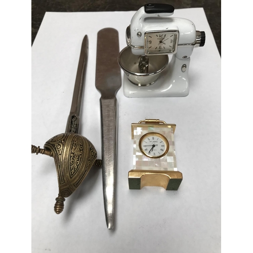 404 - FOUR ITEMS - A MINIATURE BRASS CARRIAGE CLOCK, A CLOCK HOUSED IN A  MINIATURE FOOD MIXER AND TWO LET... 