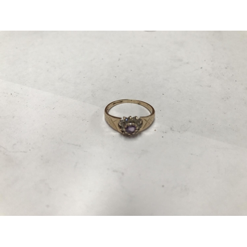 408 - A 9 CARAT GOLD LADIES RING WITH CENTRE HEART SHAPED AMETHYST