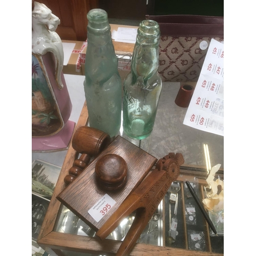 395 - A MIXED COLLECTION OF ITEMS, TWO GLASS BOTTLES WITH MARBLE STOPPERS, TREEN NUT CRACKER, DESK BLOTTER... 