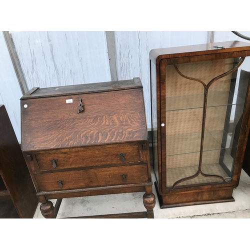 510 - AN OAK BUREAU BOOKCASE AND AN ART DECO WALNUT DISPLAY CABINET - REQUIRES RENOVATION