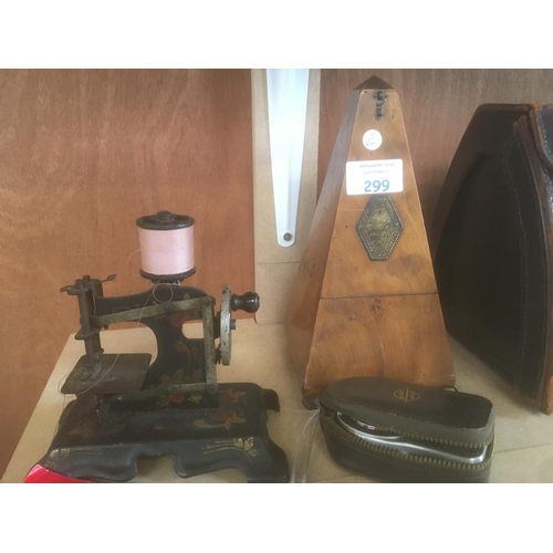 299 - A WOODEN CASED METRONOME, MINIATURE SEWING MACHINE AND A 'WESTERN MASTER' EXPOSURE METER