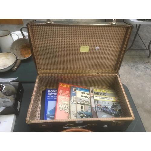 312 - A SUITCASE CONTAINING VARIOUS OWNERS WORKSHOP CAR HANDBOOKS