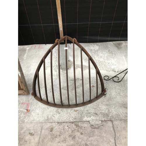 11 - A VINTAGE CAST IRON CORNER HAYRACK