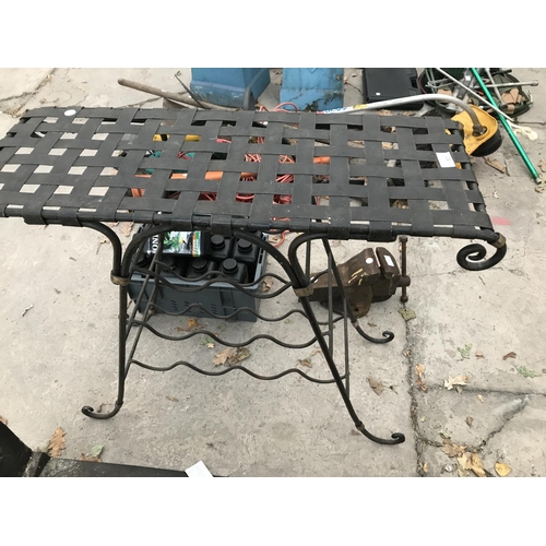 51 - A LATTICE TOPPED WROUGHT IRON TABLE WITH LOWER WINE RACK