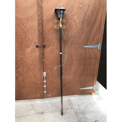 24 - A BLACK METAL COURTYARD LAMP