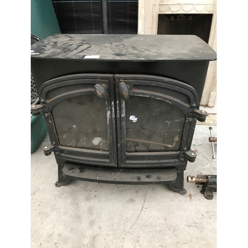 23 - A CAST IRON WOOD BURNER WITH DOUBLE DOORS