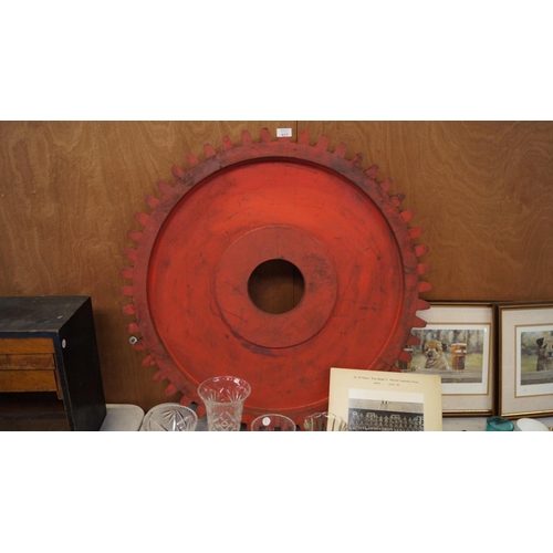 427 - A LARGE RED PAINTED WOODEN ENGINEER'S WHEEL MOULD