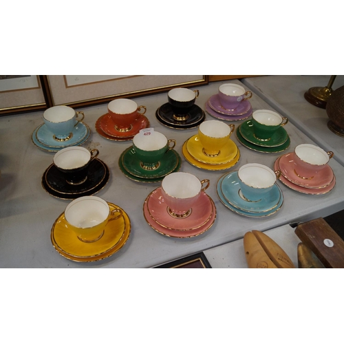 429 - THIRTY SIX PIECES OF 'EDWARDIAN BONE CHINA' COLOURFUL TRIO SETS, (SIX COLOURS) (QTY)