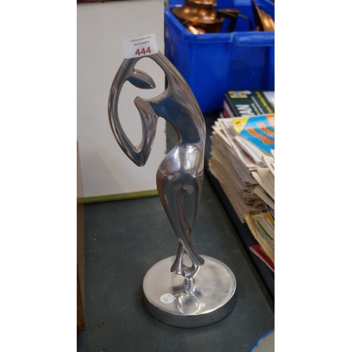 444 - AN ABSTRACT CHROME MODEL OF A DANCING LADY