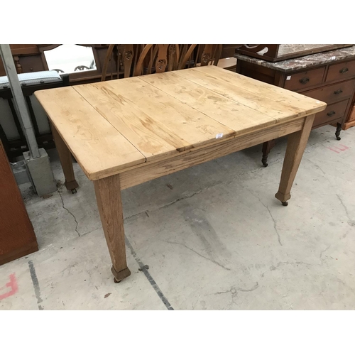 947 - A PINE AND OAK DINING TABLE