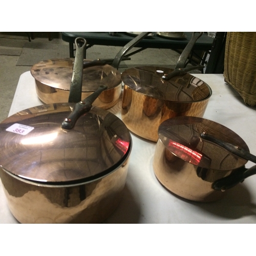 383 - A SET OF FOUR GRADUATED VINTAGE 1960'S HEAVY QUALITY BEATEN COPPER SAUCEPANS WITH CAST METAL 
 AND B... 