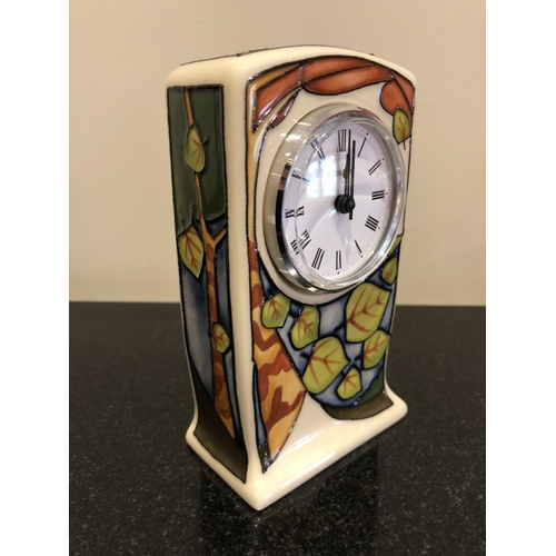 306 - A MOORCROFT POTTERY CLOCK DECORATED IN THE 'LEAVES' MARKET DAY TRIAL PATTERN DESIGNED BY VICKY LOVAT... 