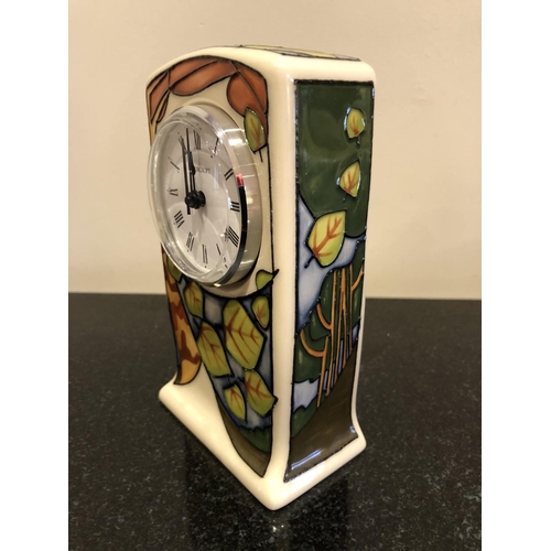 306 - A MOORCROFT POTTERY CLOCK DECORATED IN THE 'LEAVES' MARKET DAY TRIAL PATTERN DESIGNED BY VICKY LOVAT... 