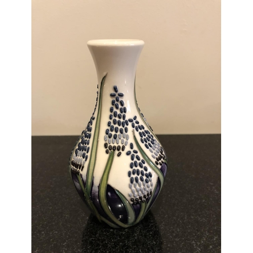 316 - A MOORCROFT POTTERY VASE DECORATED IN THE 'MUSCARI' PATTERN DESIGNED BY ELISE ADAMS IN THE 'FLYING P... 