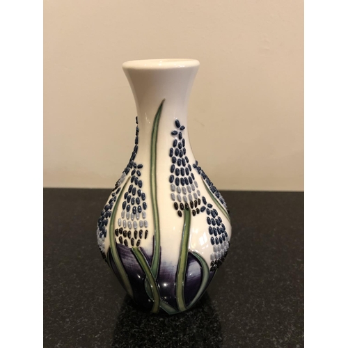 316 - A MOORCROFT POTTERY VASE DECORATED IN THE 'MUSCARI' PATTERN DESIGNED BY ELISE ADAMS IN THE 'FLYING P... 