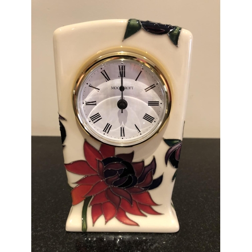 331 - A MOORCROFT POTTERY CLOCK DECORATED IN THE 'RUBY RED' PATTERN DESIGNED BY EMMA BOSSONS, SHAPE NUMBER... 