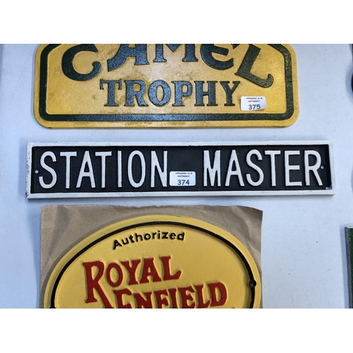 374 - A BLACK AND WHITE CAST METAL 'STATION MASTER' SIGN