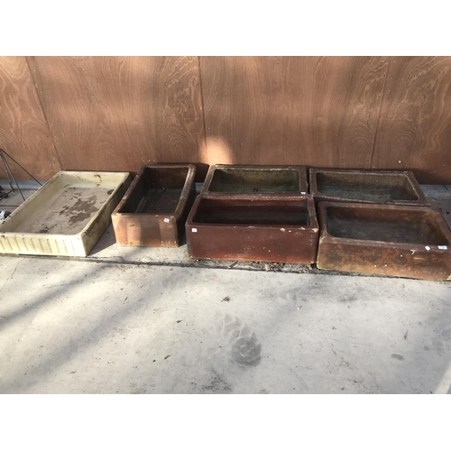 77 - FIVE VINTAGE SALT GLAZED TROUGHS AND A VINTAGE SHALLOW SINK