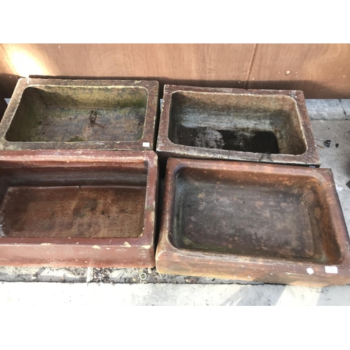 77 - FIVE VINTAGE SALT GLAZED TROUGHS AND A VINTAGE SHALLOW SINK