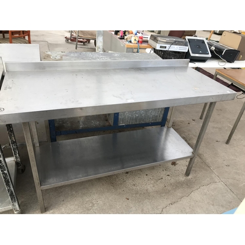 165 - A STAINLESS STEEL CATERING BENCH WITH SPLASHBACK AND LOWER SHELF - WIDTH 150 CM, HEIGHT 95 CM, DEPTH... 