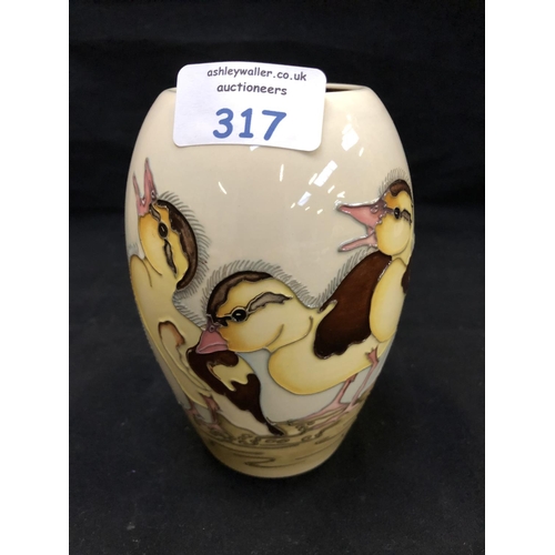 317 - A NUMBERED EDITION (184) MOORCROFT POTTERY VASE DECORATED IN THE 'SPRING DUCKLING' PATTERN DESIGNED ... 