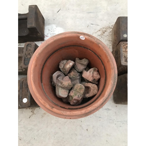 108 - SIX 56 LB WEIGHTS A TERRACOTTA POT CONTAINING TERRACOTTA LION PLANT STANDS AND A MARBLE BLOCK 62 CM ... 